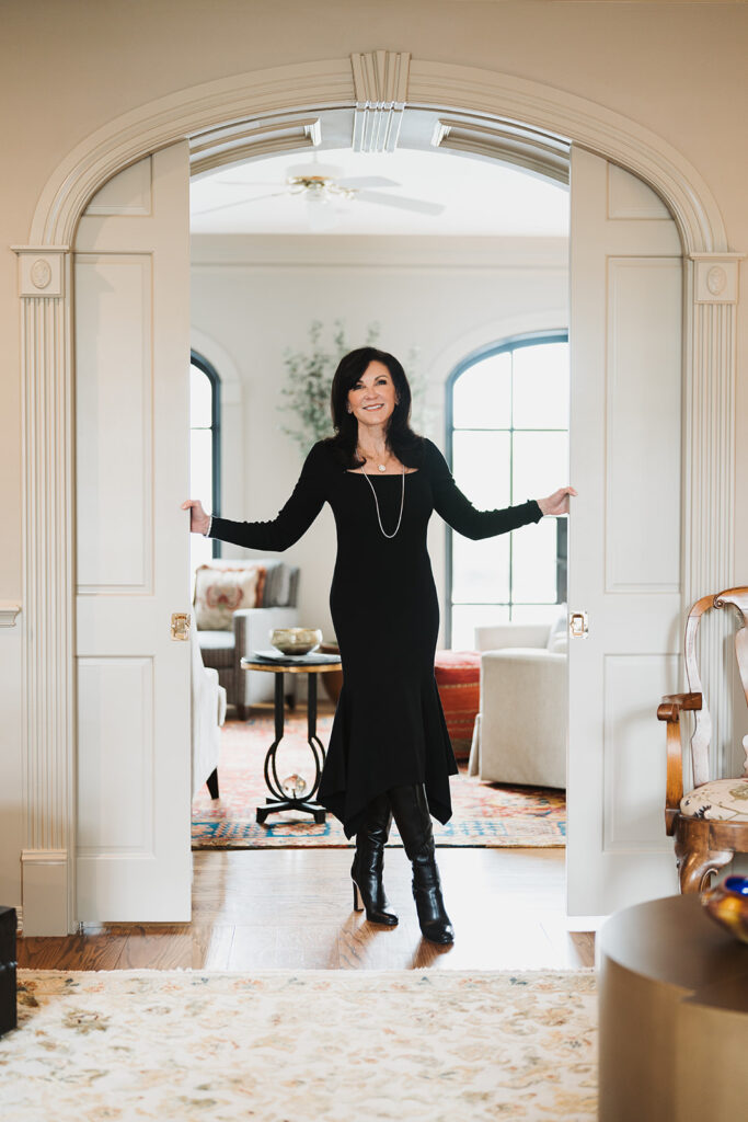 Julia Gardner of David Gardner's Jewelry stands in a doorway at her home in Bryan, Texas. 