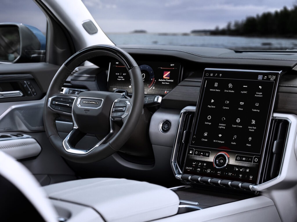 Interior shot of the 2024 GMC Acadia Denali showing the first application of a 15-inch-diagonal, portrait-orientation infotainment touch screen.