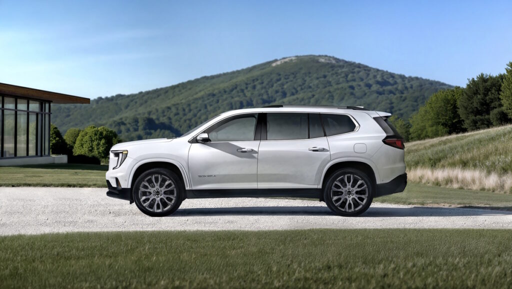 Side profile view of the 2026 GMC Acadia Denali Ultimate in Glacier White Tricoat. Preproduction model shown. Actual production model will vary.